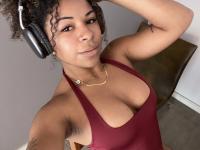 Ebony solo girl with a full head of curly hair models a lot of outfits - Photo #11