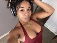 Ebony solo girl with a full head of curly hair models a lot of outfits - Photo #12