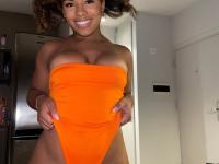 Ebony solo girl with a full head of curly hair models a lot of outfits - Photo #18