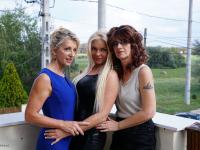 Mature lesbians share a kiss before embarking on a threesome - Photo #1