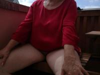 Horny oma spreads her upskirt pussy after pulling down her hose on patio - Photo #13