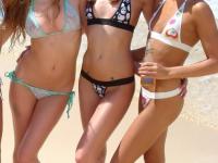 A slew of young and beautiful teens doff bikinis to play naked at the beach - Photo #1