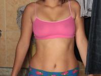 Horny teen with pigtails Roxane exposes her big ass and natural breasts - Photo #1