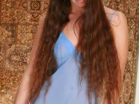 Leggy amateur with long hair reveals her trimmed pussy atop a railing - Photo #1