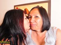 Latina granny Andrea has lesbian sex on a bed with a young girl - Photo #11