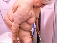 Morbidly obese old woman steps out onto a patio while totally naked - Photo #2