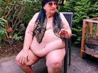 Morbidly obese old woman steps out onto a patio while totally naked - Photo #17