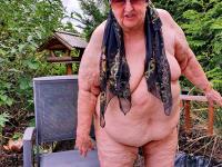 Morbidly obese old woman steps out onto a patio while totally naked - Photo #19