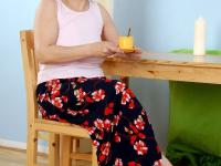 Old big breasted granny takes off her skirt and shows off her old hairy muff. - Photo #1