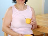Old big breasted granny takes off her skirt and shows off her old hairy muff. - Photo #2
