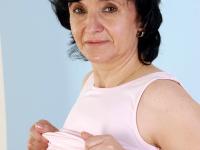 Old big breasted granny takes off her skirt and shows off her old hairy muff. - Photo #11