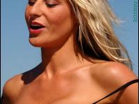 Hot blonde Tasha Baxter releases her fake tits while at the beach - Photo #10