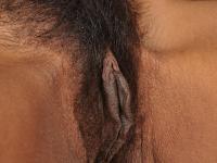 Slender ebony MILF Lippz fingering her fuzzy pussy by the fireplace - Photo #15
