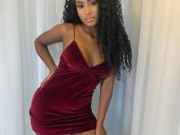 Cute ebony girl models a short red velvet dress as well as a black top and jeans - Photo #3