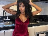 Cute ebony girl models a short red velvet dress as well as a black top and jeans - Photo #4
