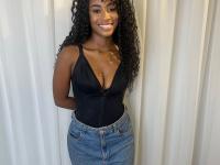 Cute ebony girl models a short red velvet dress as well as a black top and jeans - Photo #11
