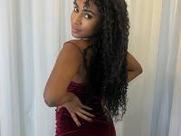 Cute ebony girl models a short red velvet dress as well as a black top and jeans - Photo #12