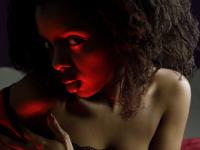 Pretty black girl Sukki T unveils her hairy pussy during a striptease on a bed - Photo #3