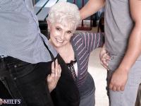 Short haired blond granny Jewel taking cum on face after blowing a 3some cock - Photo #2