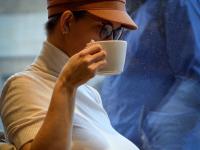 Amateur girl exposes her big tits while out in public in a cap and glasses - Photo #1