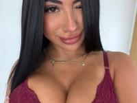 Solo girl with dark hair and tattoos frees her big butt from sensual lingerie - Photo #1