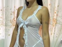 Brunette teen covers up her small tits while changing her underwear - Photo #1