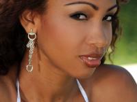 Exotic Latina MILF Katia De Lys toys her booty while posing in her sexy bikini - Photo #1
