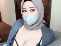 Chubby Asian girl covers her face with a hijab while exposing her big tits - Photo #8