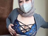 Chubby Asian girl covers her face with a hijab while exposing her big tits - Photo #20