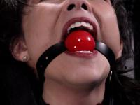 Asian girl is masturbated while restrained and ball gagged in an dungeon - Photo #9