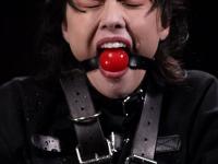 Asian girl is masturbated while restrained and ball gagged in an dungeon - Photo #17
