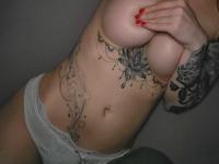 Glamorous babe teases with her juicy tits while showing off her tattoos - Photo #6