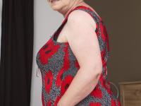 Redheaded granny has her big boobs fondled while being masturbated - Photo #3