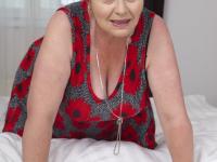 Redheaded granny has her big boobs fondled while being masturbated - Photo #6