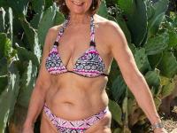 Slutty granny Demi strips naked & toys her old pussy with a dildo by the pool - Photo #4