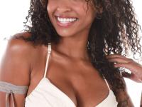 Ebony solo girl Barbie Rous uncovers her big tits before showing her bald pussy - Photo #7