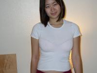 Asian with hairy bush Mei grabs her clit and fingers her wet pussy - Photo #1