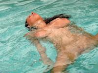 Adorable pornstar Gianna Michaels plays with her big boobs & a toy in the pool - Photo #17