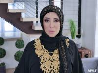 Busty MILF Kylie Kingston gets banged by a boy on a sofa while wearing a hijab - Photo #1