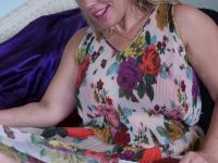 Older blonde woman blows a kiss after stripping to her jewelry - Photo #6