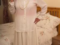 Slutty granny Rosemary toying her hungry old pussy in a red corset - Photo #1