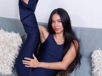 Long haired beauty doffs a tight jumpsuit for great nude poses on a sofa - Photo #2