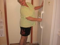 Old woman Girdle Goddess strips to pantyhose in her kitchen - Photo #1