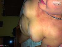 Old woman Busty Bliss takes a cumshot on her big natural tits - Photo #16