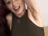 Redhead with hairy underarms Ivy Addams finger spreads her bush on a bed - Photo #2