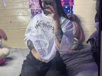 Brunette teen takes selfies while stripping to her thong on a bed - Photo #1
