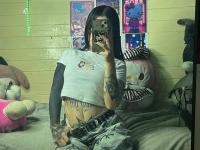 Brunette teen takes selfies while stripping to her thong on a bed - Photo #2