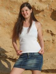 Squinting brunette Lima undresses in the sun to show hairy ass at the beach