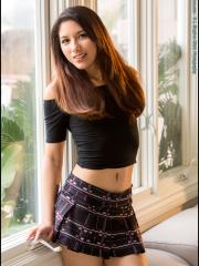 Asian model Melody Wylde gets completely naked afore a window