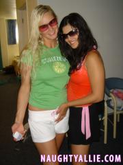Blonde amateur Naughty Allie engages in lesbian play during a boat party